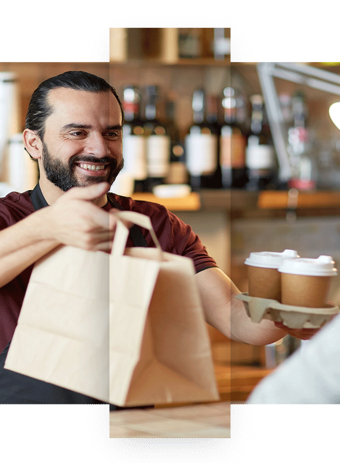 Coffee owner handing a customer coffee and takeout